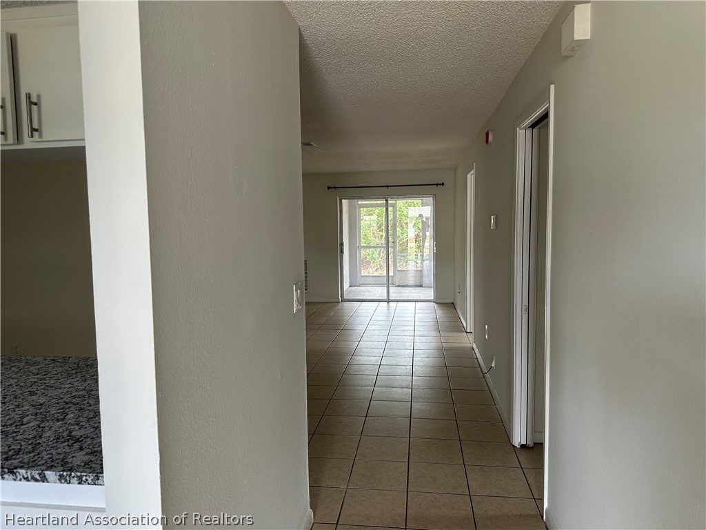 237 Rhapsody Avenue Lake Placid, FL 33852 - Photo 3 of 18 a view of hallway with a couch