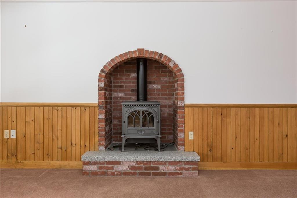 95 Thurston Road Norway, ME 04268 - Photo 23 of 33 basement has Jotul glass front woodstove