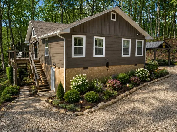 a front view of a house with garden