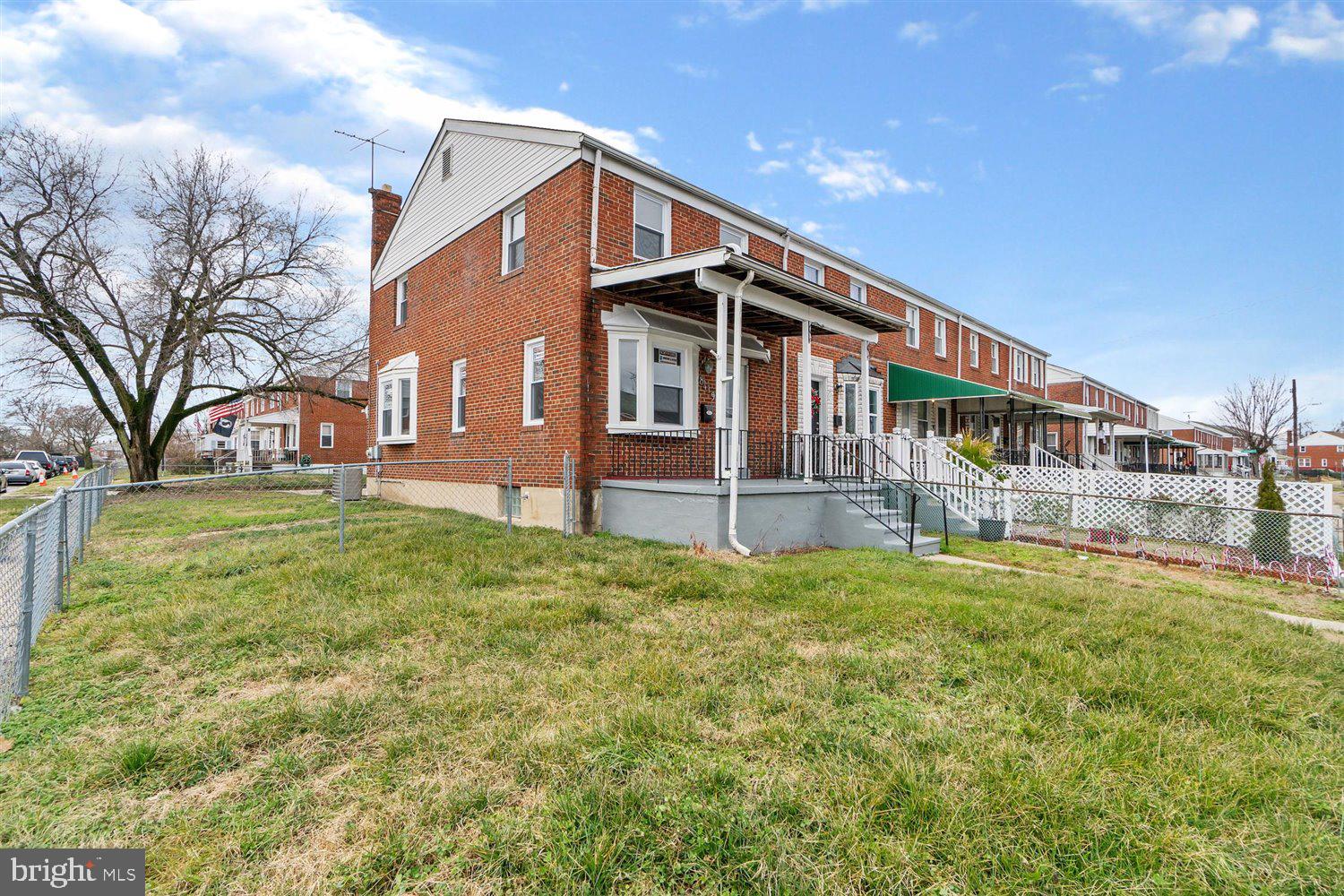 8419 Kavanagh Road Baltimore, MD 21222 - Photo 2 of 31 a front view of a house with a yard