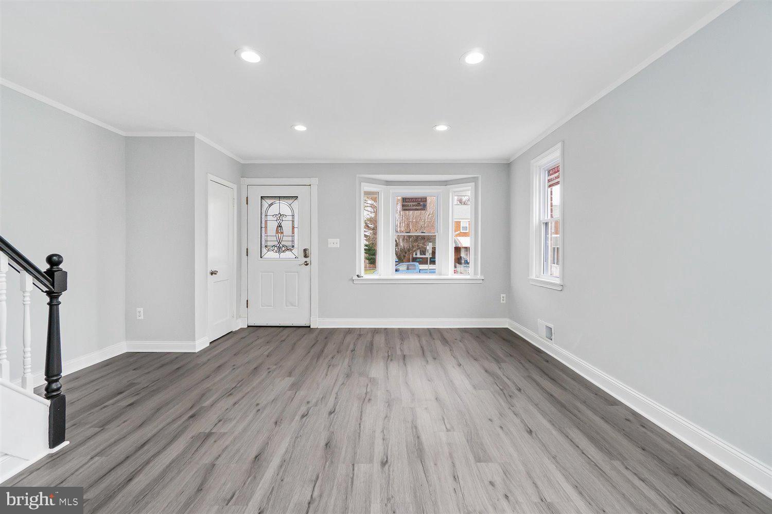 8419 Kavanagh Road Baltimore, MD 21222 - Photo 11 of 31 wooden floor in an empty room with a window
