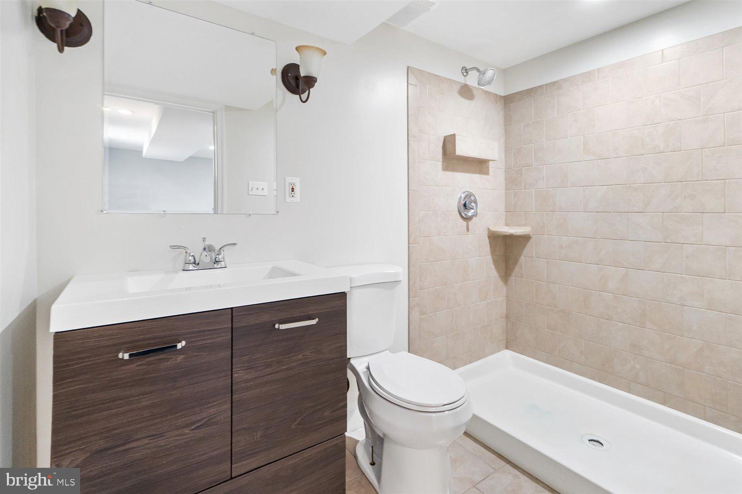 8419 Kavanagh Road Baltimore, MD 21222 - Photo 21 of 31 a bathroom with a sink a toilet and shower