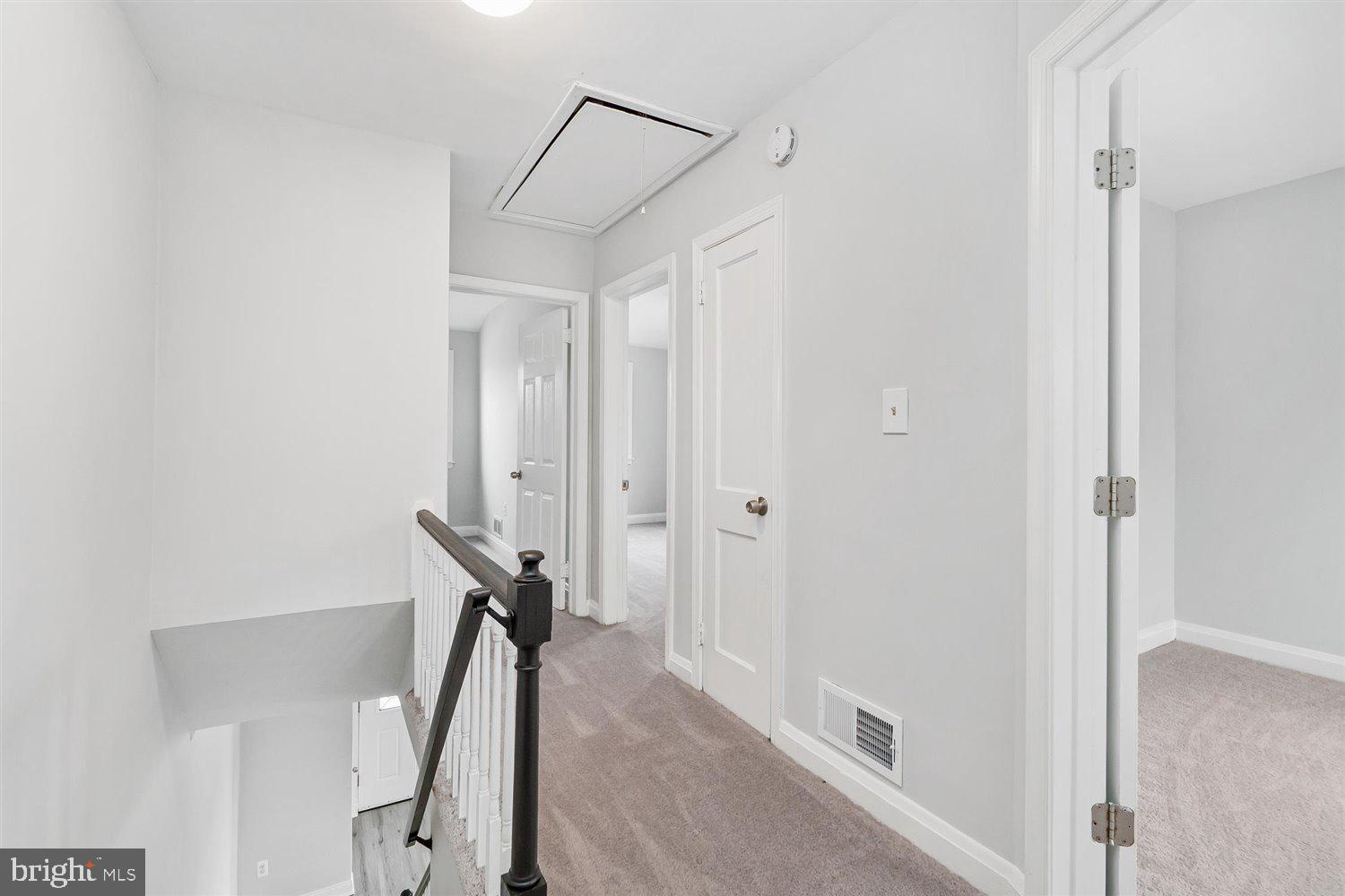 8419 Kavanagh Road Baltimore, MD 21222 - Photo 25 of 31 a view of a hallway with staircase