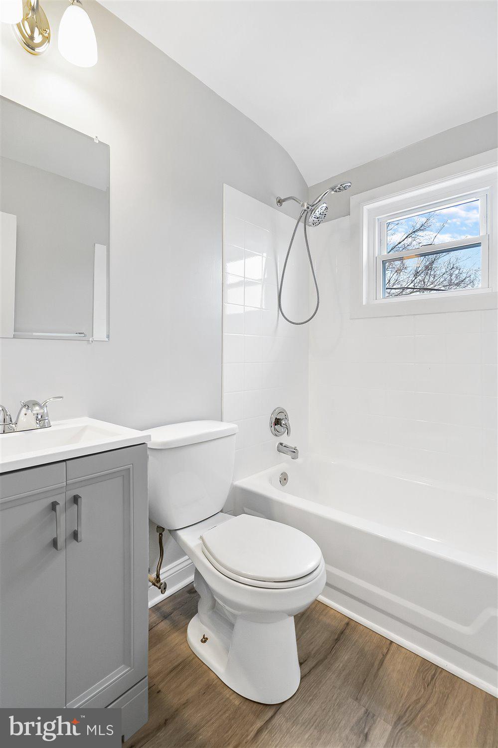 8419 Kavanagh Road Baltimore, MD 21222 - Photo 27 of 31 a white toilet sitting next to a bathroom sink