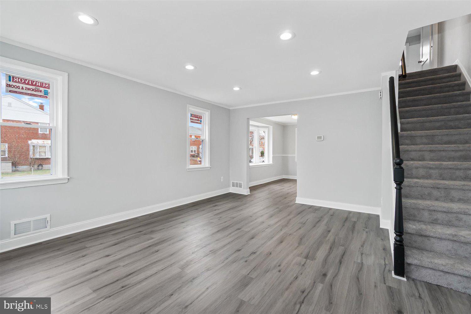 8419 Kavanagh Road Baltimore, MD 21222 - Photo 6 of 31 a view of wooden floor and windows in a room