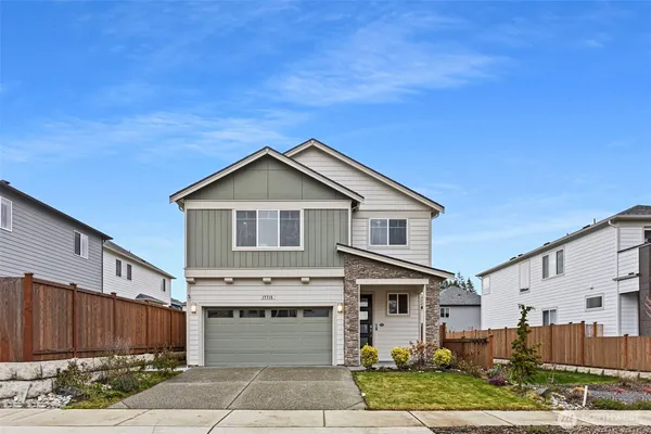 a front view of a house with a yard