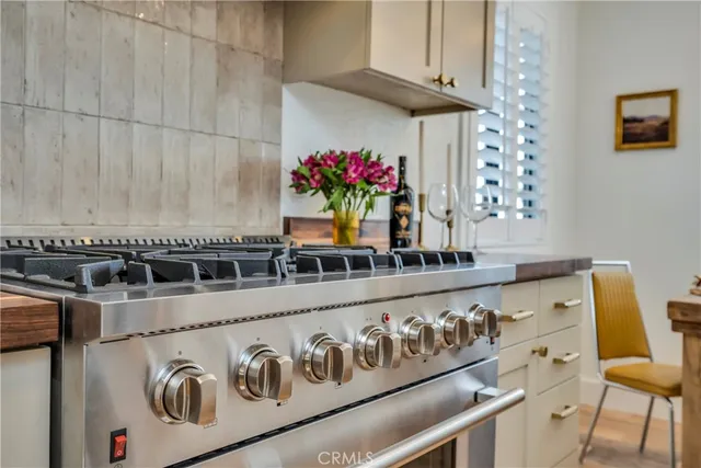 a kitchen with a microwave and a potted plant