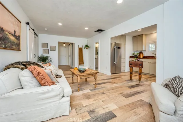 a bedroom with furniture and a large mirror