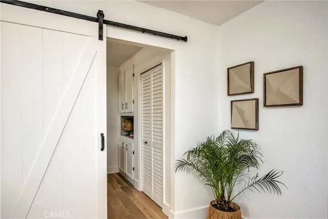 a bathroom with a granite countertop sink mirror vanity and toilet