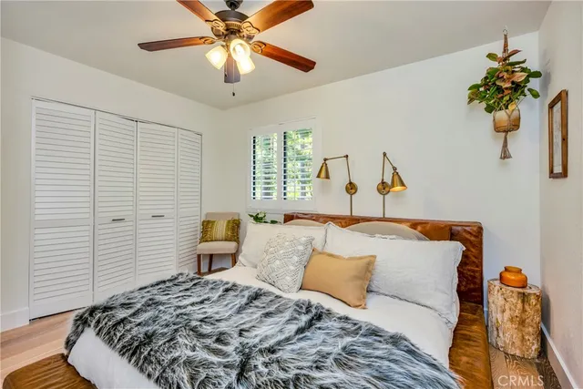 a bedroom with a large bed and a large window