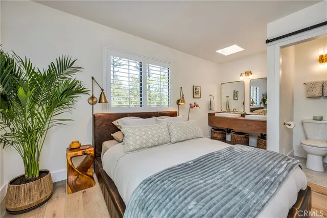 a view of a balcony with wooden chairs and bench