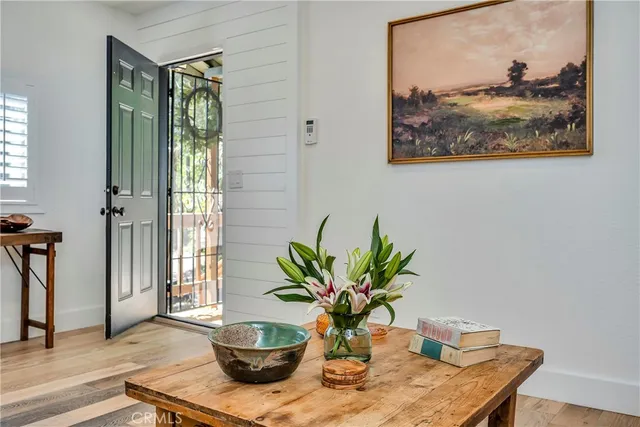 a view of a flower pot on a table with a potted plant