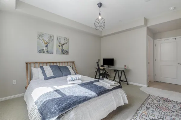 a bedroom with a bed and a table in it