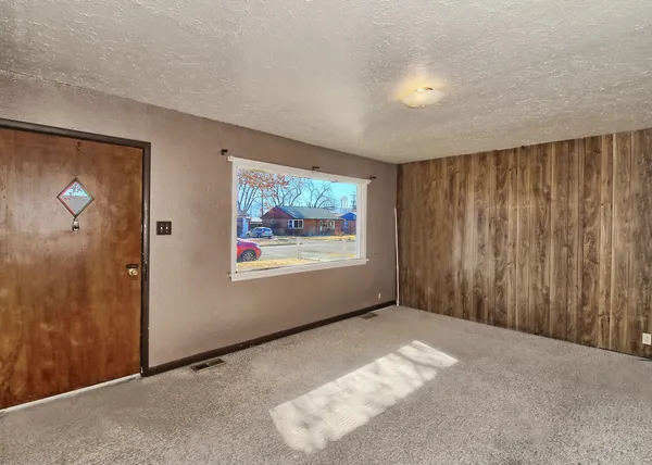 a view of an empty room with a window