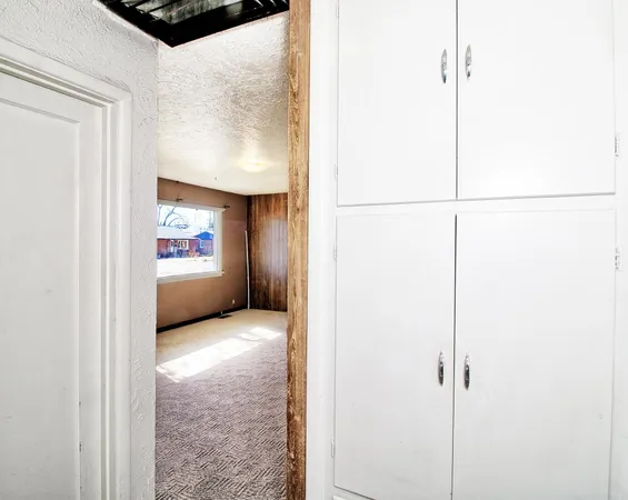 a view of hallway with a hallway and a stove