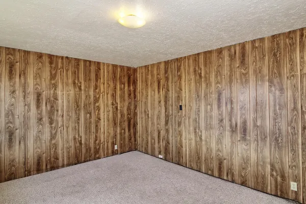 a view of a big room with wooden walls