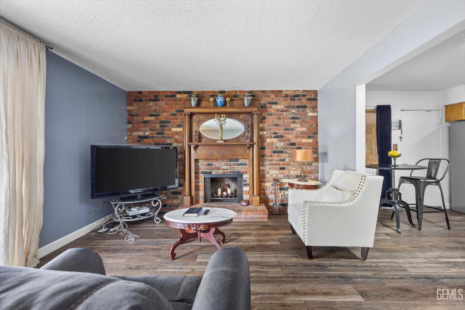 Undisclosed Address Taft, CA 93268 - Photo 18 of 42 a living room with furniture and a flat screen tv