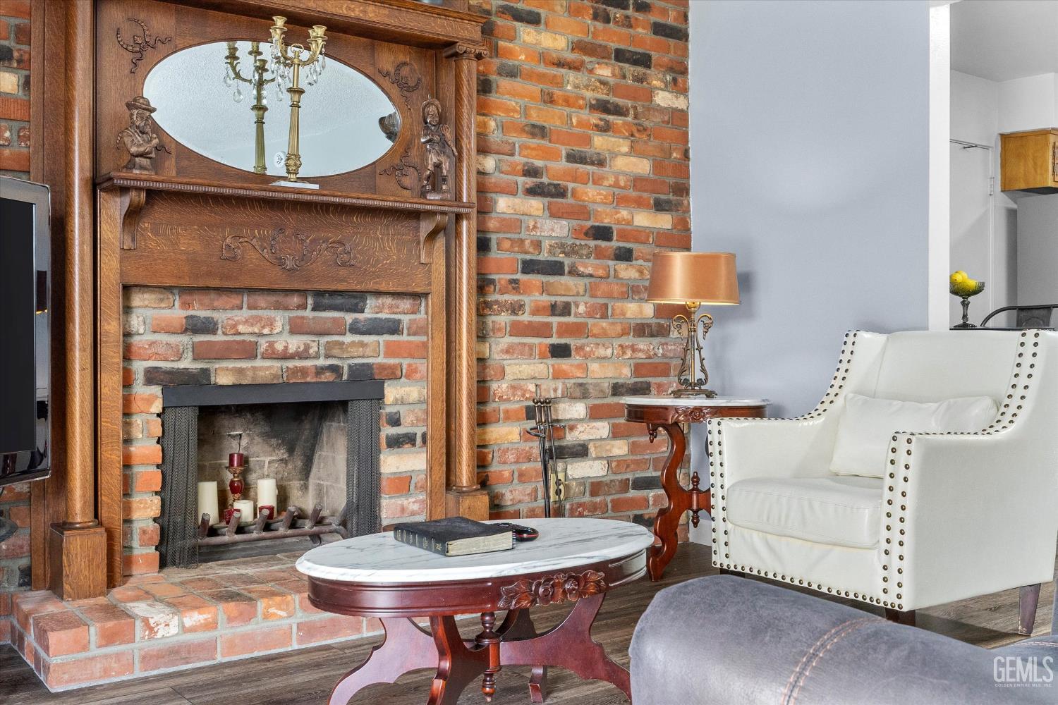 Undisclosed Address Taft, CA 93268 - Photo 20 of 42 a living room with furniture and a fireplace