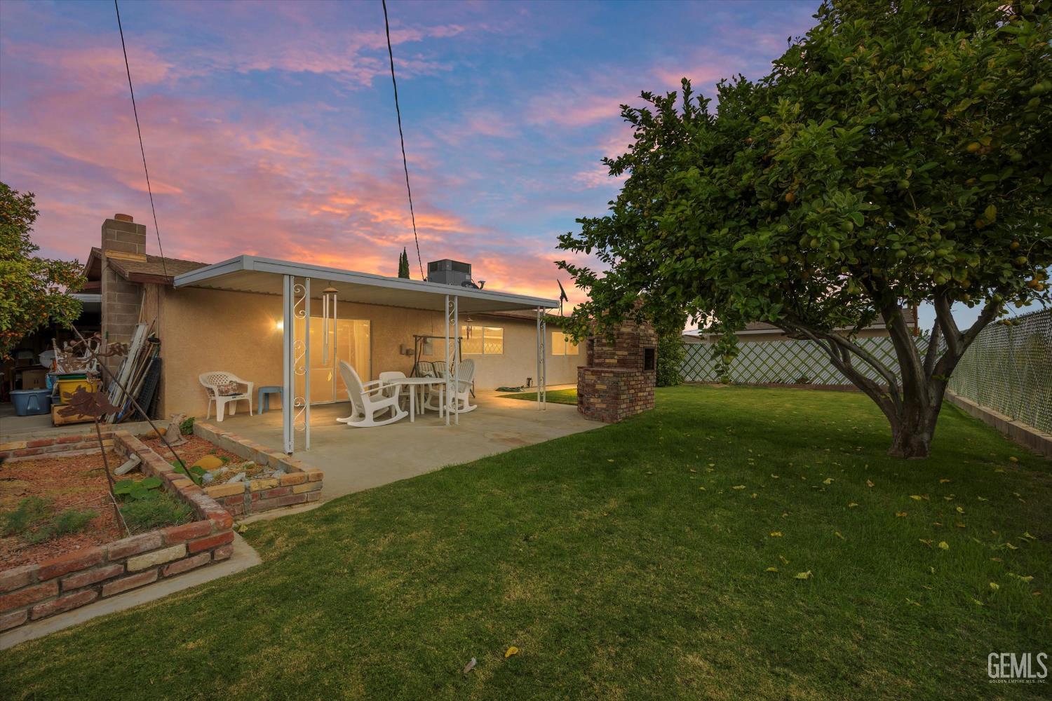 Undisclosed Address Taft, CA 93268 - Photo 2 of 42 a front view of a house with garden