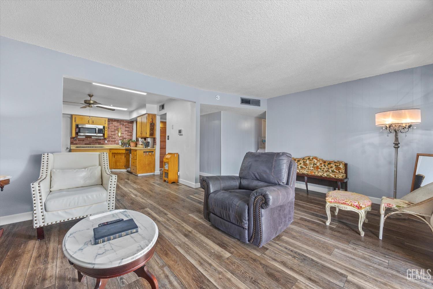 Undisclosed Address Taft, CA 93268 - Photo 22 of 42 a living room with furniture and a table