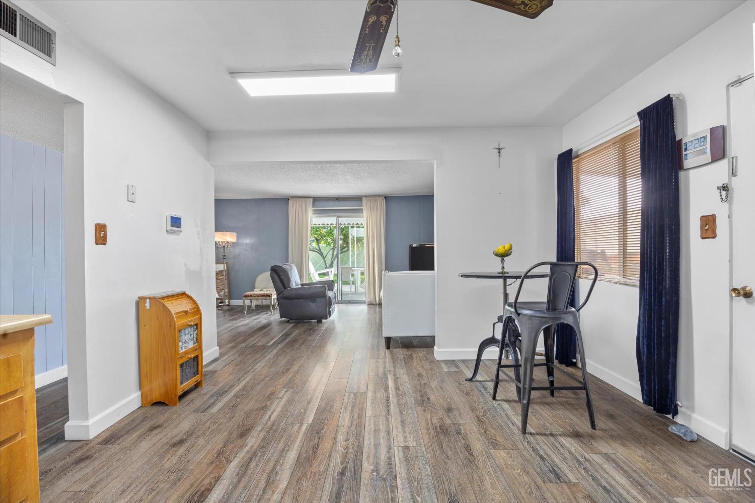 Undisclosed Address Taft, CA 93268 - Photo 25 of 42 a living room with furniture and a wooden floor