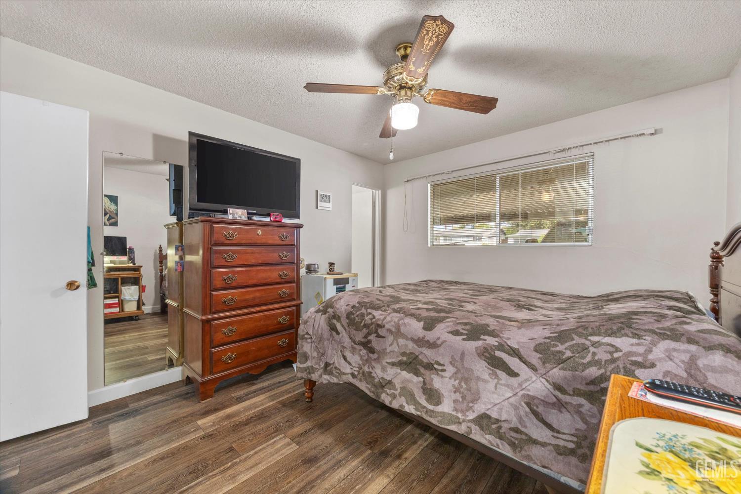 Undisclosed Address Taft, CA 93268 - Photo 32 of 42 a bedroom with a bed and a flat screen tv