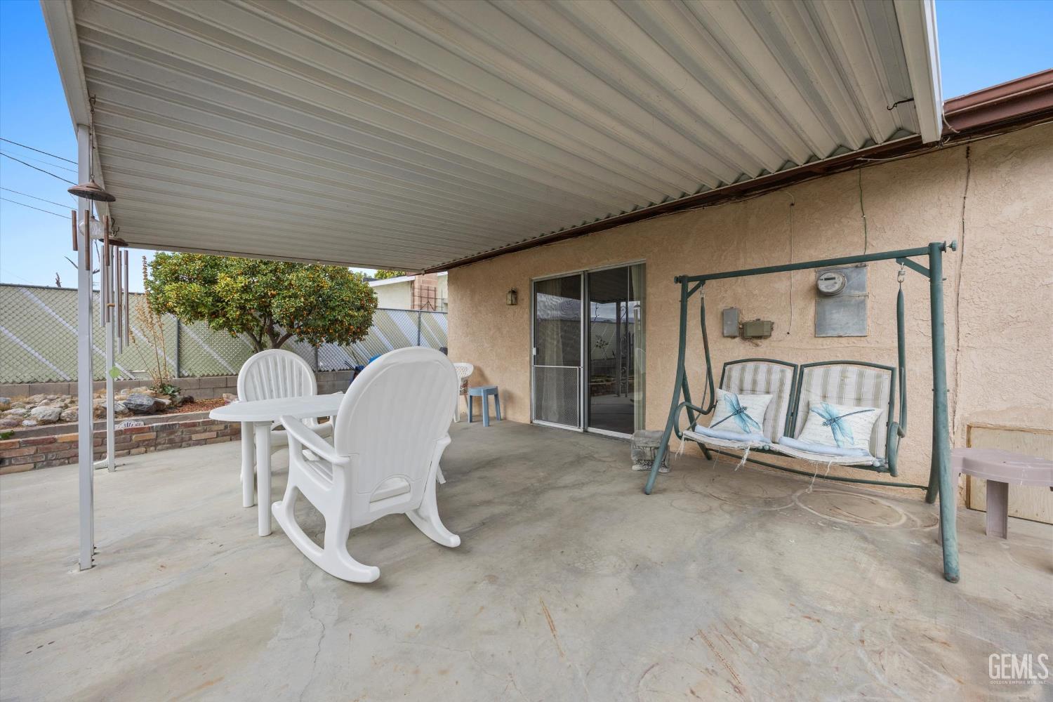 Undisclosed Address Taft, CA 93268 - Photo 37 of 42 a view of a patio with table and chairs and a barbeque
