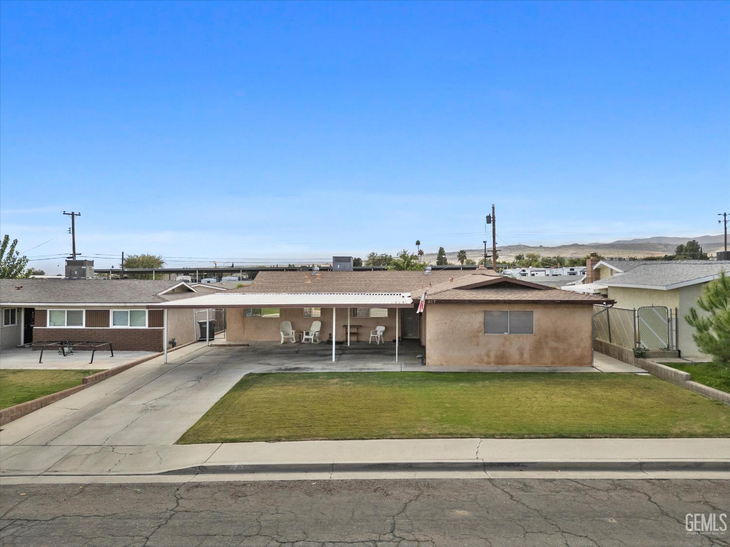 Undisclosed Address Taft, CA 93268 - Photo 7 of 42 a view of a house with a swimming pool