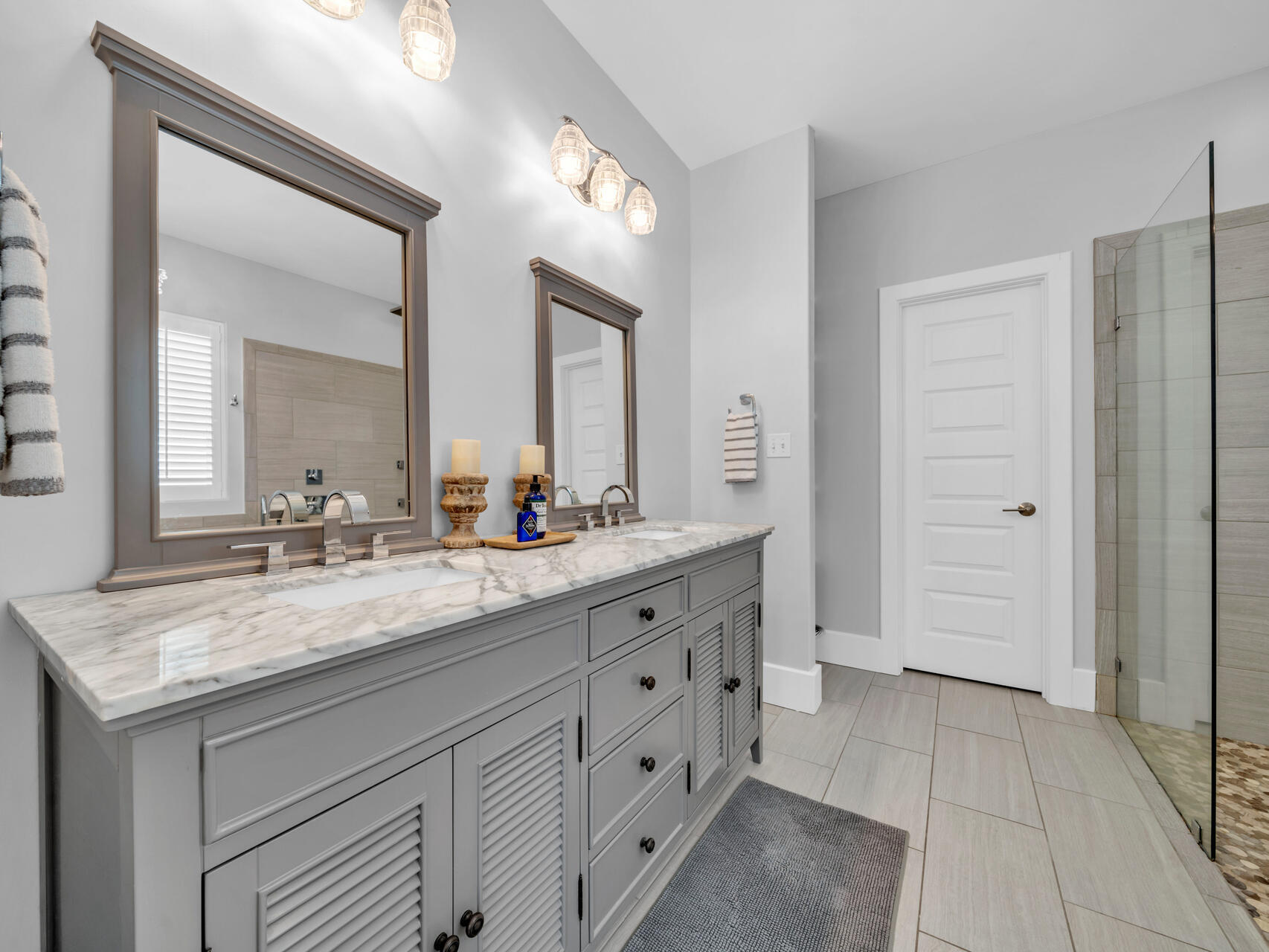160 Rearden Way Santa Rosa Beach, FL 32459 - Photo 17 of 84 a spacious bathroom with a granite countertop sink and a mirror