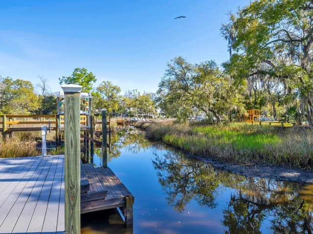 a view of a patio with chairs next to a yard