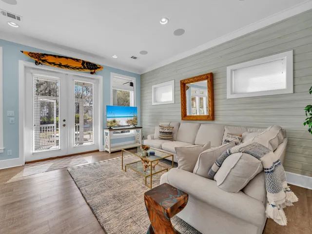 a bed sitting in a spacious bedroom next to a window