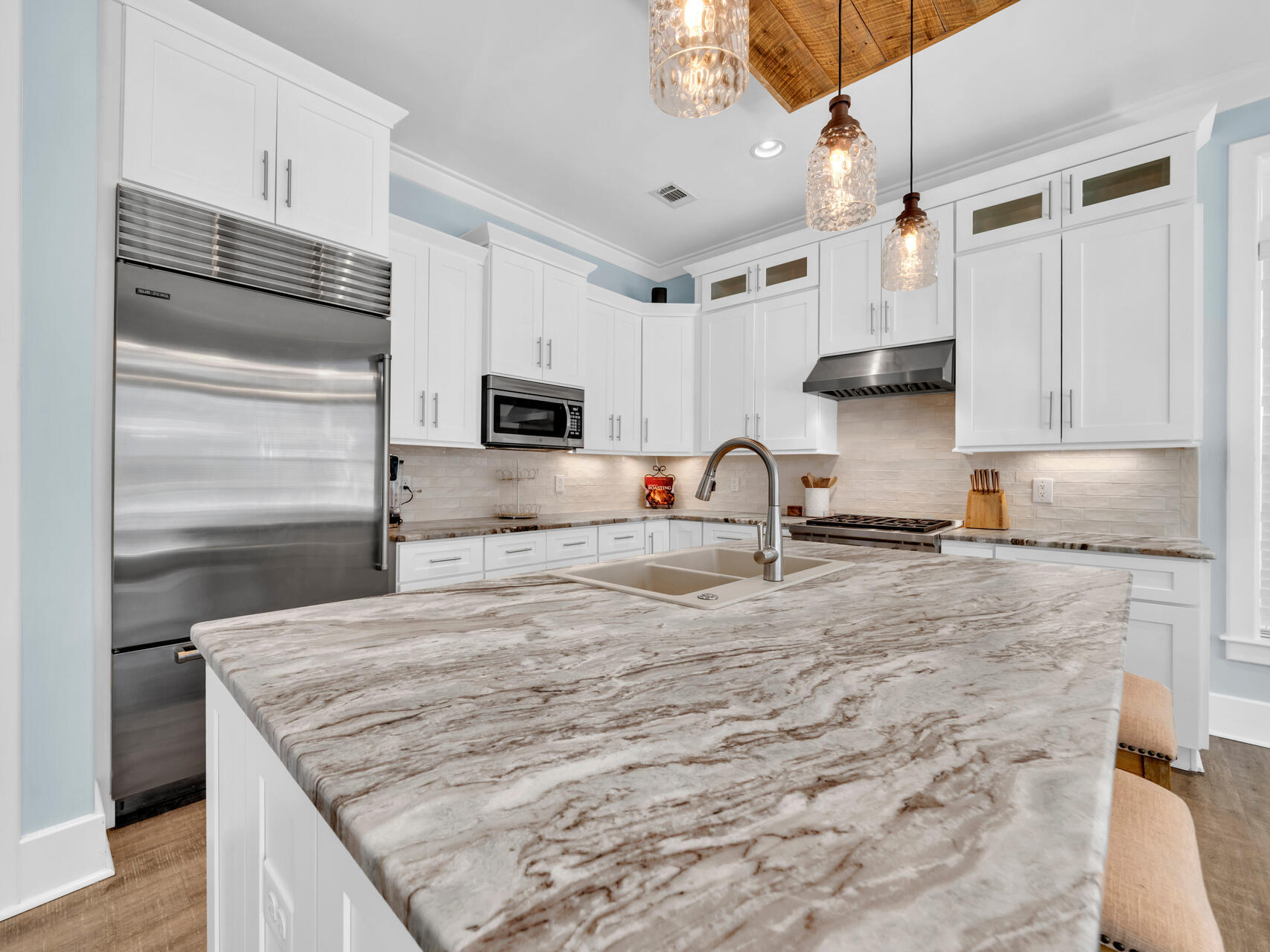 160 Rearden Way Santa Rosa Beach, FL 32459 - Photo 36 of 84 a kitchen with stainless steel appliances granite countertop a sink stove and refrigerator