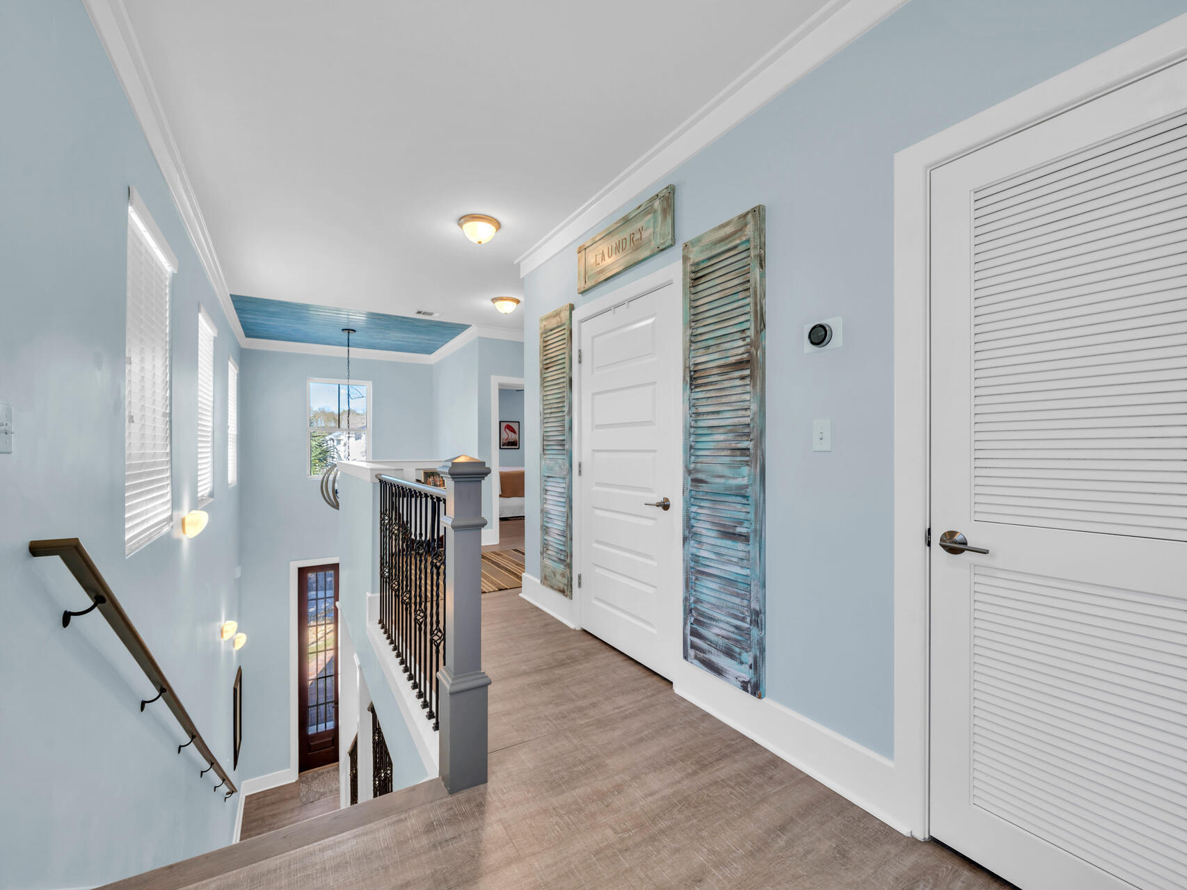 160 Rearden Way Santa Rosa Beach, FL 32459 - Photo 39 of 84 a view of a hallway with furniture and a wooden floor