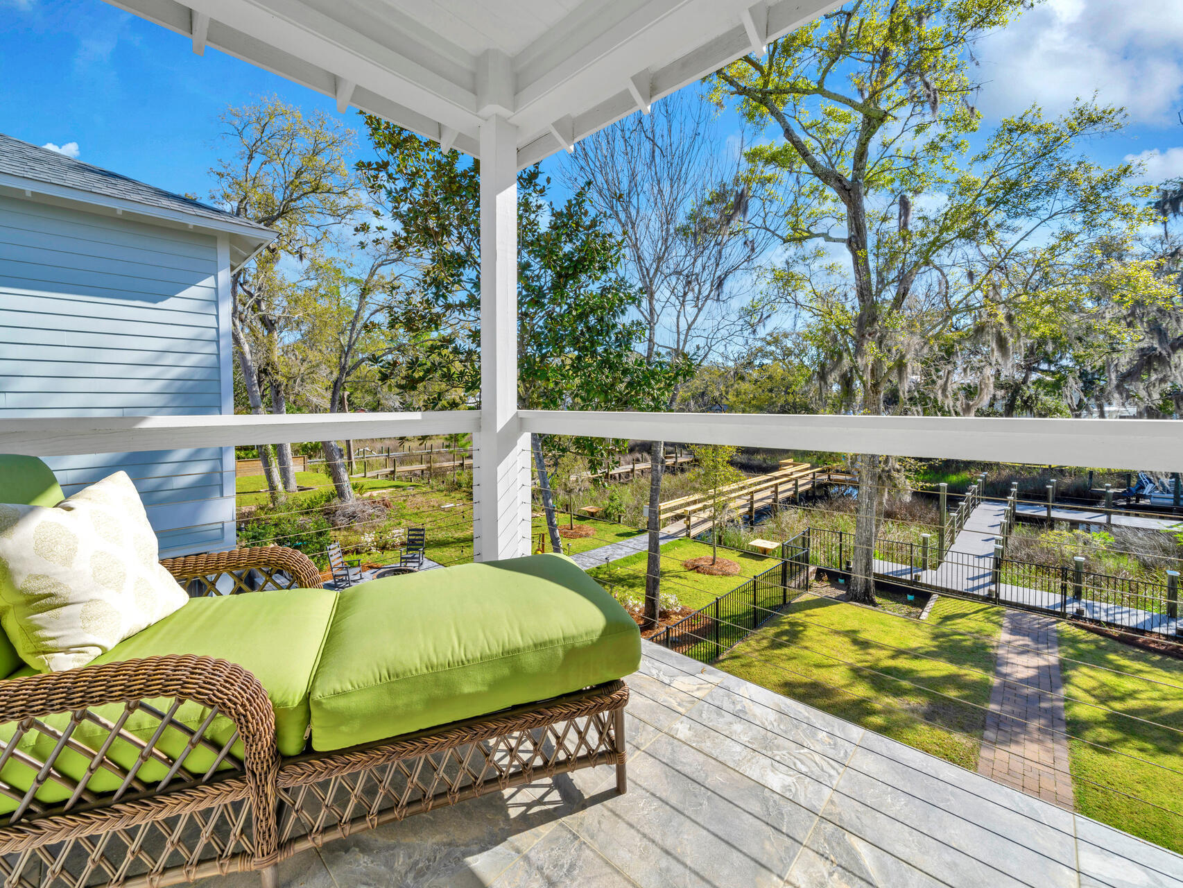 160 Rearden Way Santa Rosa Beach, FL 32459 - Photo 44 of 84 a view of a balcony with wooden floor and outdoor seating