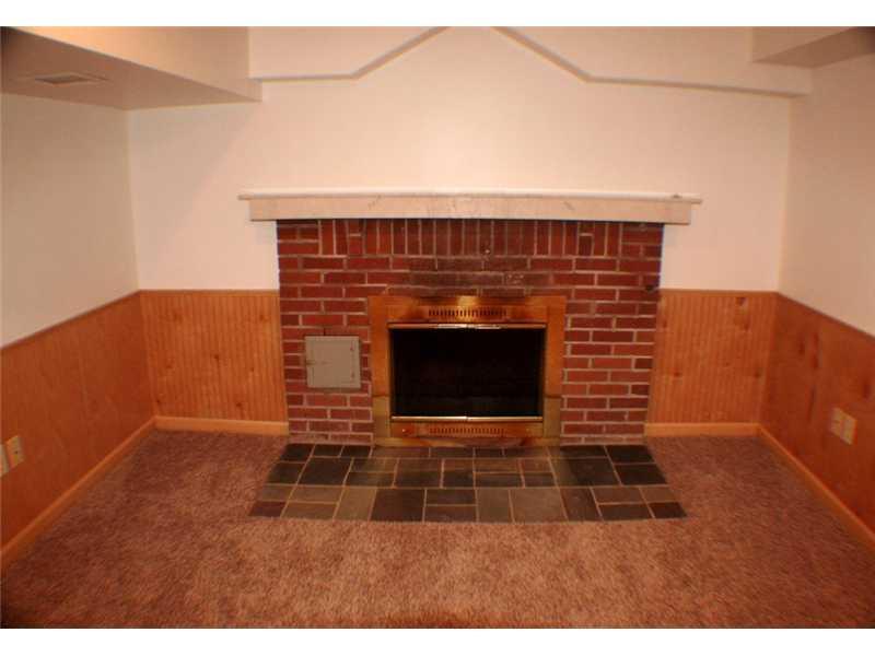 210 Siebert Road Pittsburgh, PA 15237 - Photo 18 of 25 Den/Family/Great Room. The Brick Fireplace in the Lower Level Gameroom