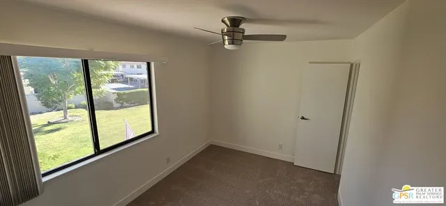 a view of a room with a window