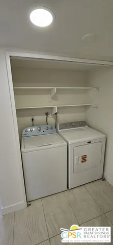 a utility room with washer and dryer