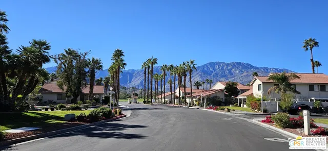 a view of a street with cars
