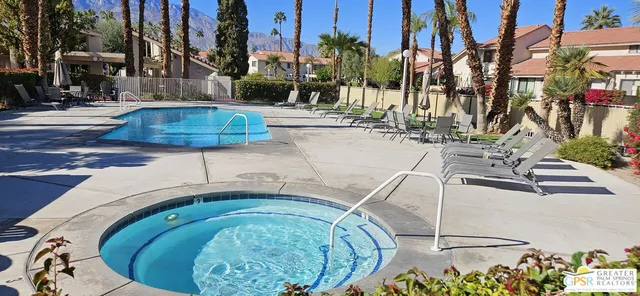a view of a swimming pool with a patio
