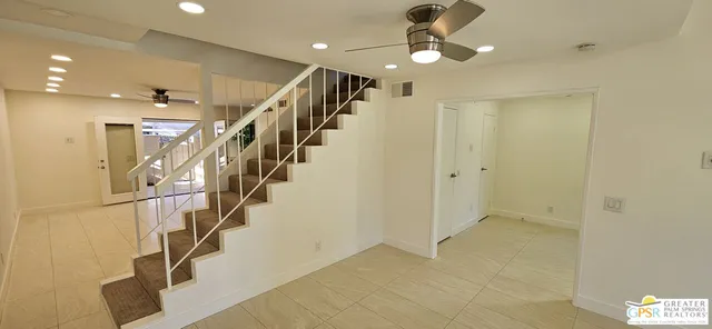 a view of entryway and hall with a chandelier