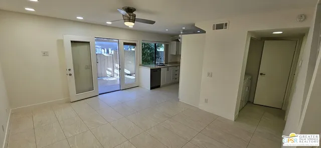 a view of an empty room with a bathroom