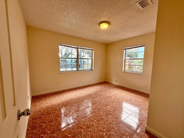 a view of an empty room and window
