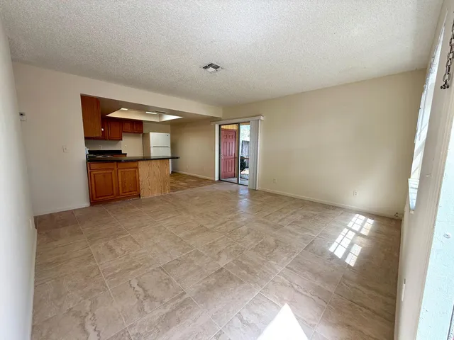 a view of a kitchen with a sink and dishwasher cabinets