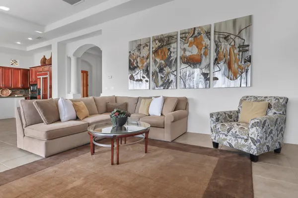 a living room with furniture and a painting