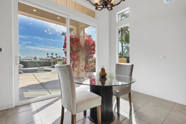 a view of a dining room with furniture window and outside view