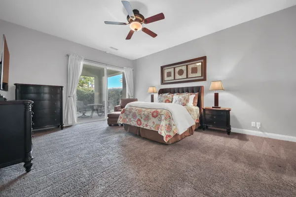 a bedroom with a bed and a tv