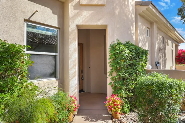 front view of a house with a potted plant