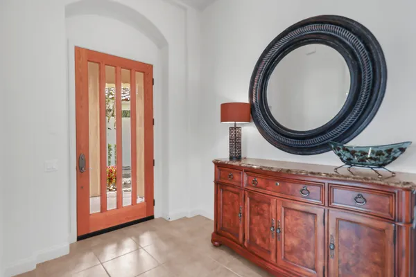 a bathroom with a sink a mirror and a window
