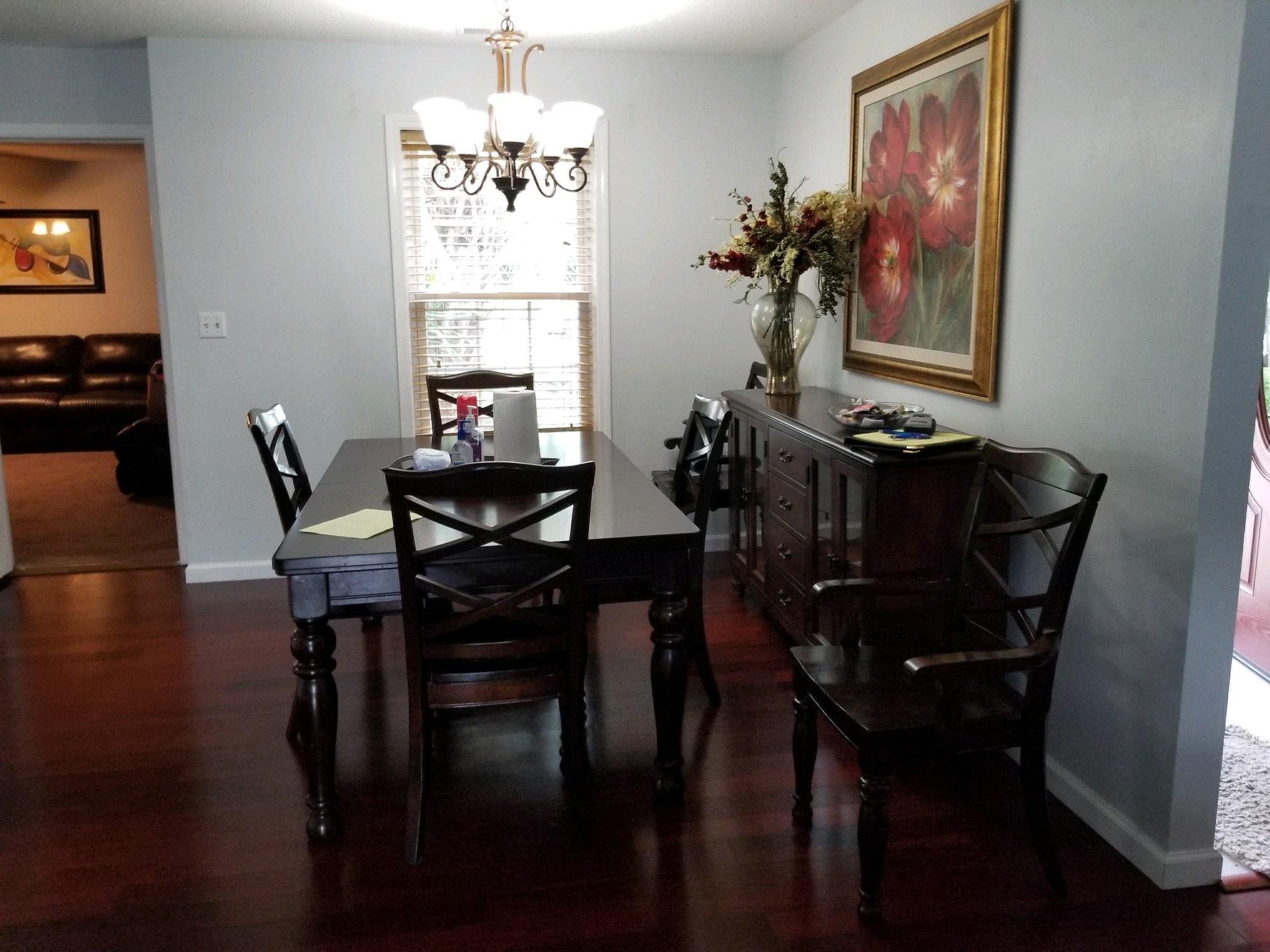 147 Nicole Lane Crestview, FL 32539 - Photo 11 of 13 a view of a dining room with furniture window and wooden floor