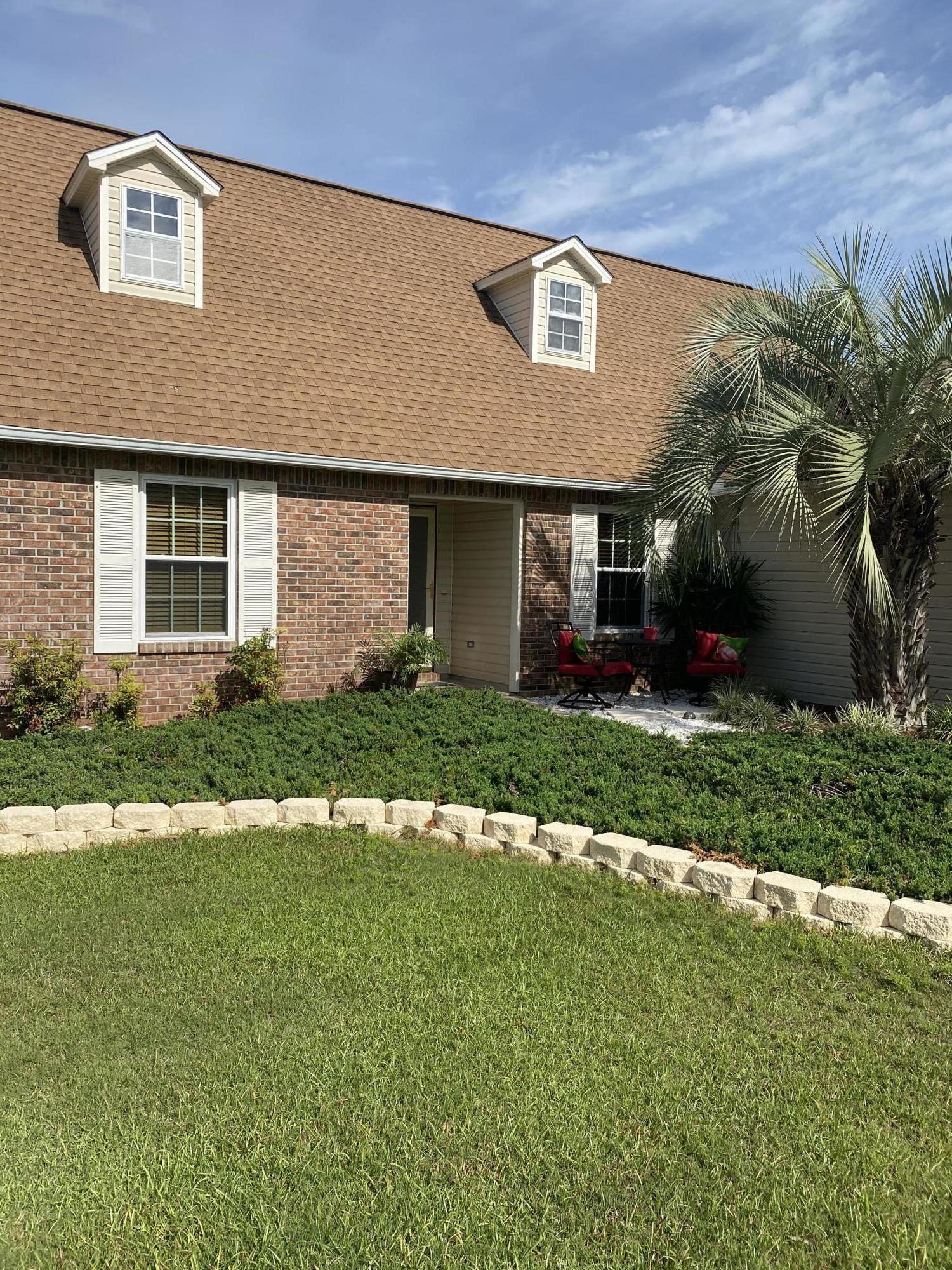 147 Nicole Lane Crestview, FL 32539 - Photo 4 of 13 a front view of house with yard and green space